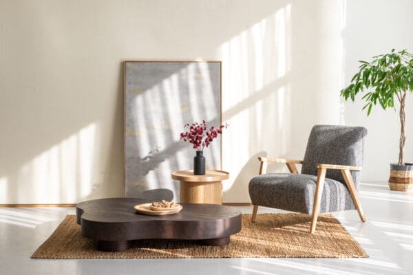 japandi coffee table with japandi lounge chair in a japandi scandinavian setting with side table and mat
